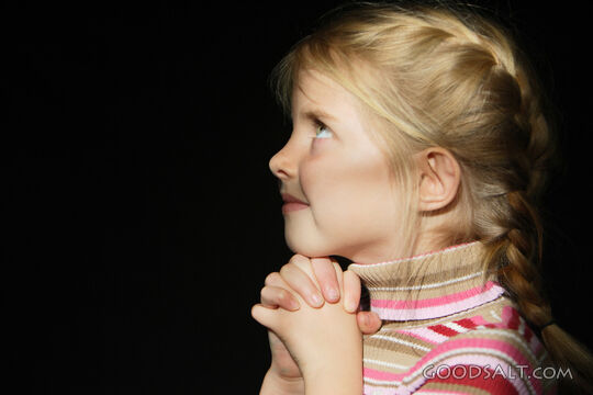 IDAHO. Boise. Little girl looking up and praying. MR