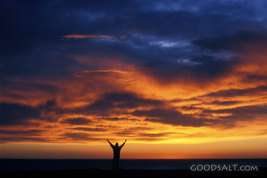 Silhouett of Person at Sunset With Clowdy Sky