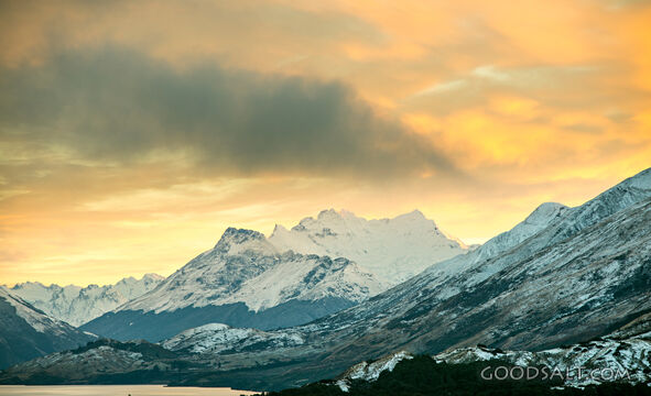 snow covered mountains in colorful sunset
